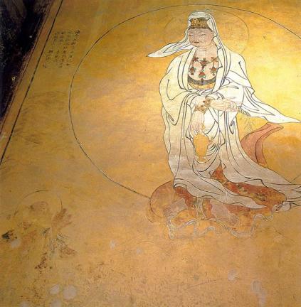 White-clothing Avalokitesvara Bodhisattva Statue in Behid Wall